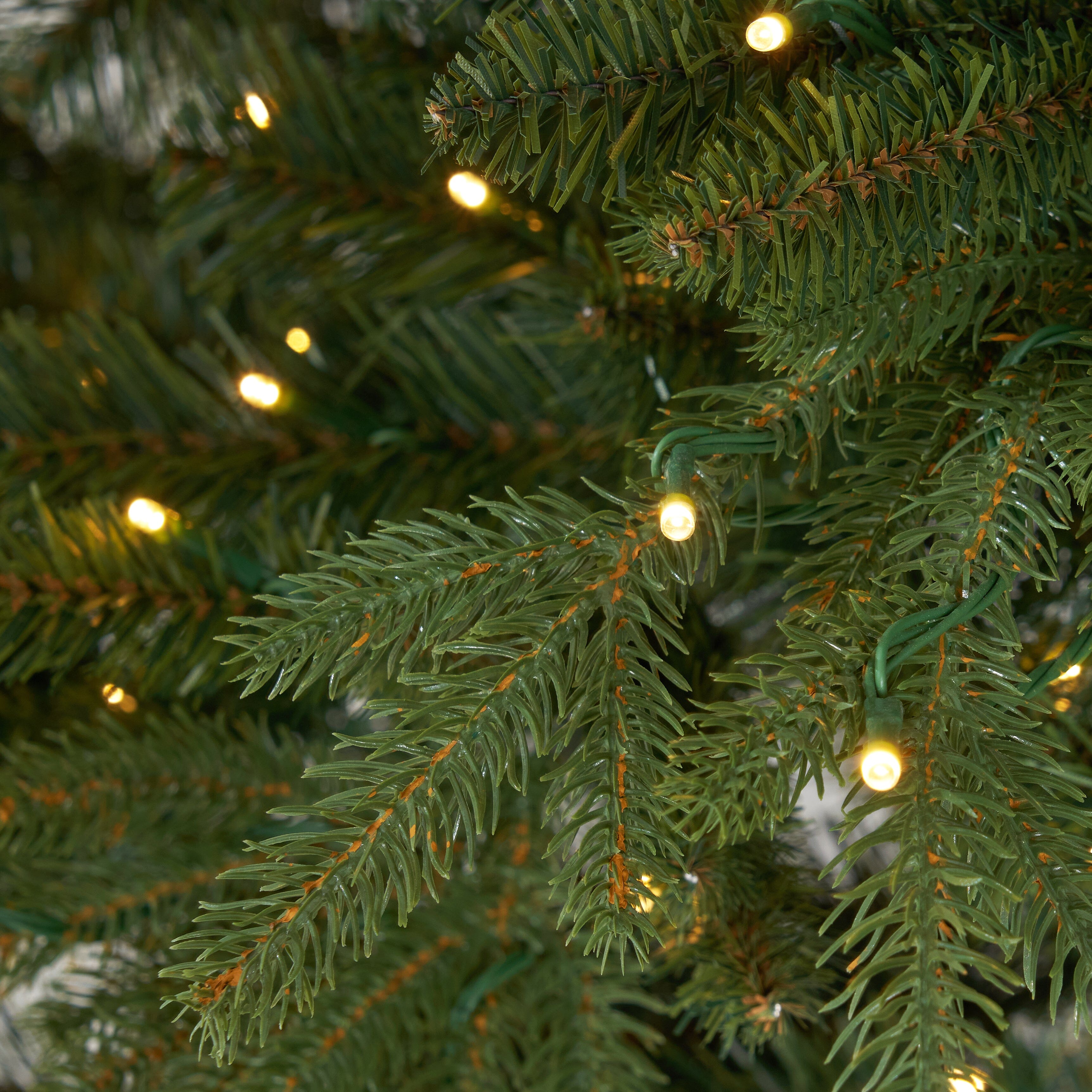 11' Belgium Fir “Natural Look” Artificial Christmas Tree with 1250 Clear LED Lights and 4222 Bendable Branches
