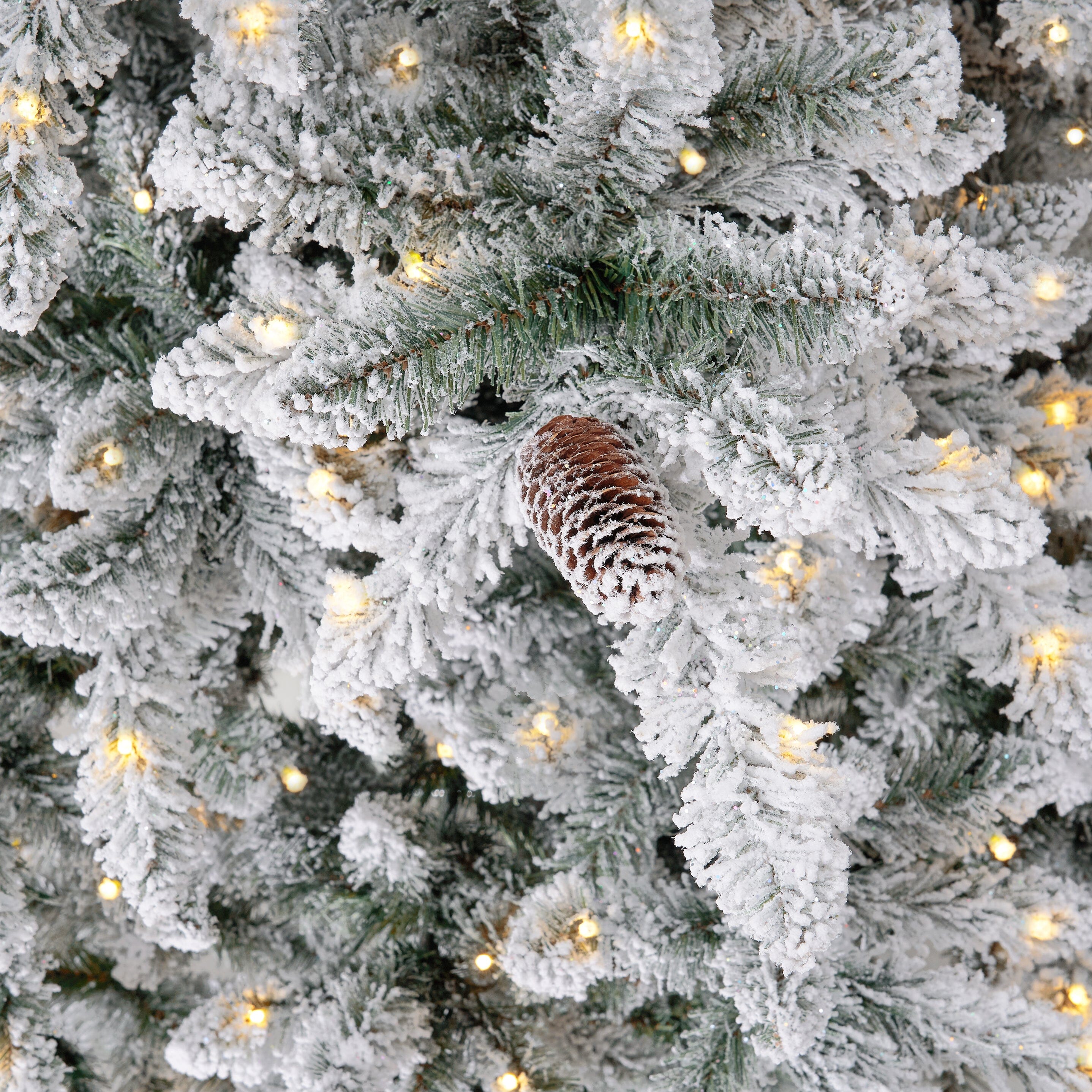 11' Flocked Livingston Fir Artificial Christmas Tree with Pine Cones, 950 Clear Warm LED Lights and 3016 Bendable Branches