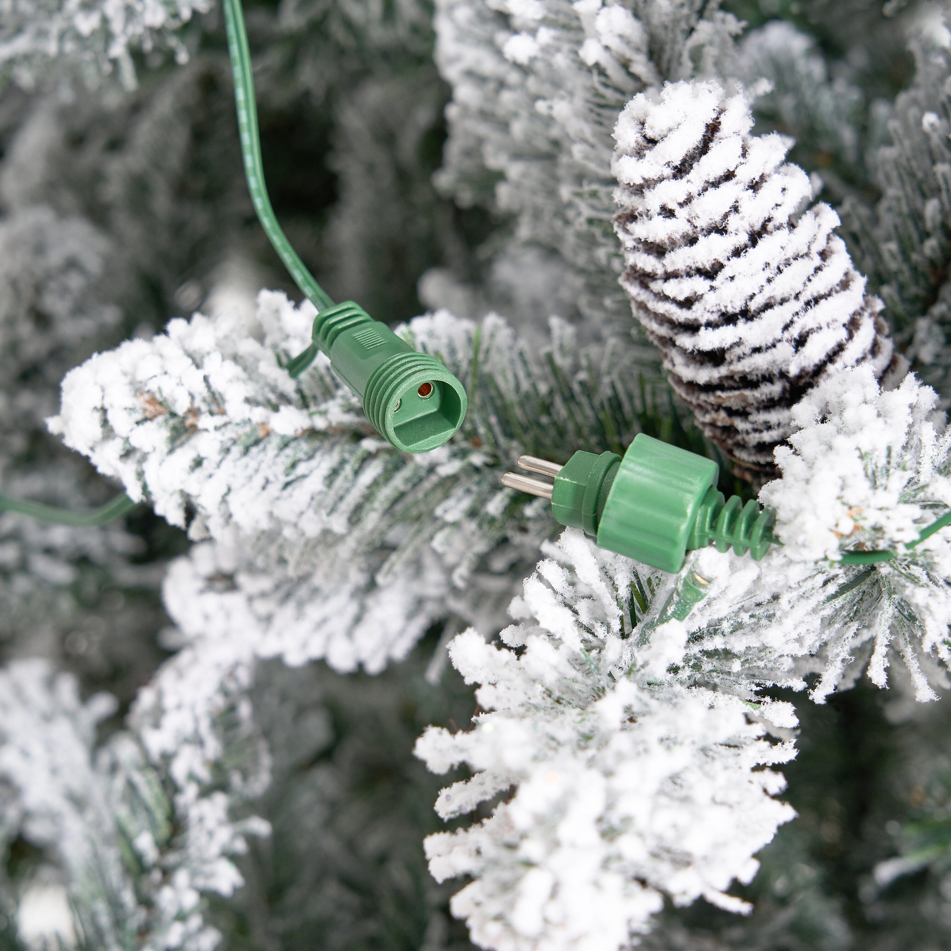 11' Flocked Livingston Fir Artificial Christmas Tree with Pine Cones, 950 Clear Warm LED Lights and 3016 Bendable Branches