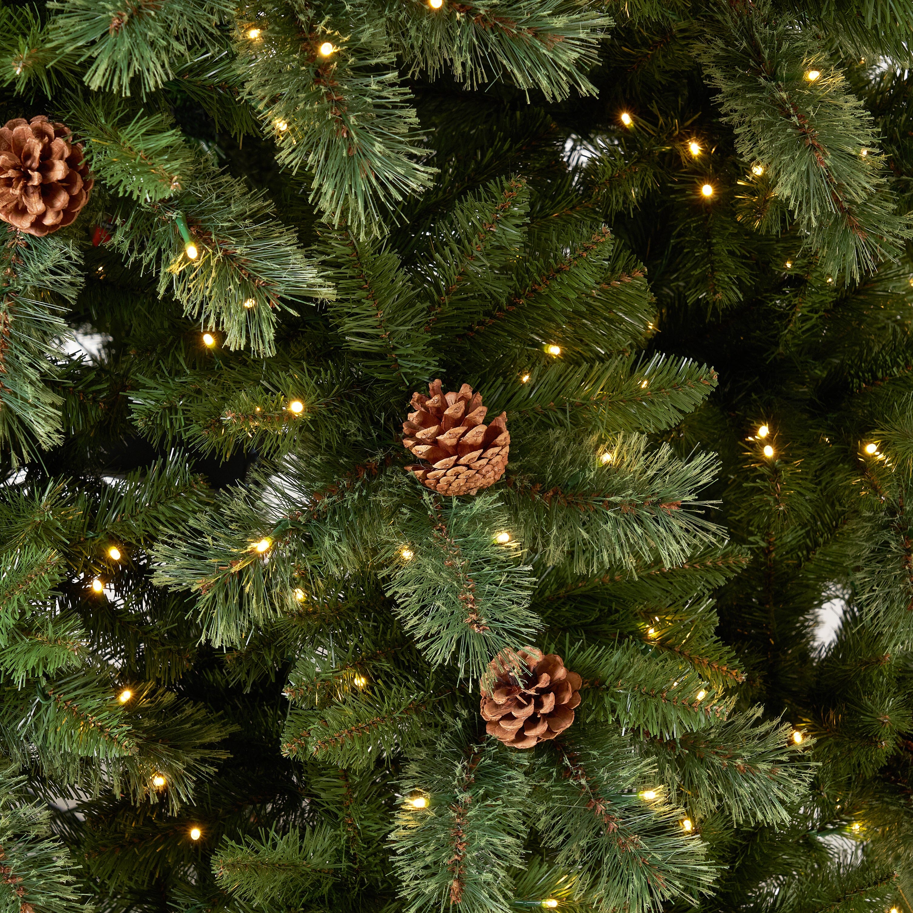 11' White Mountain Pine Artificial Christmas Tree with 1050 Clear LED Lights, Pine Cones and 2395 Bendable Branches